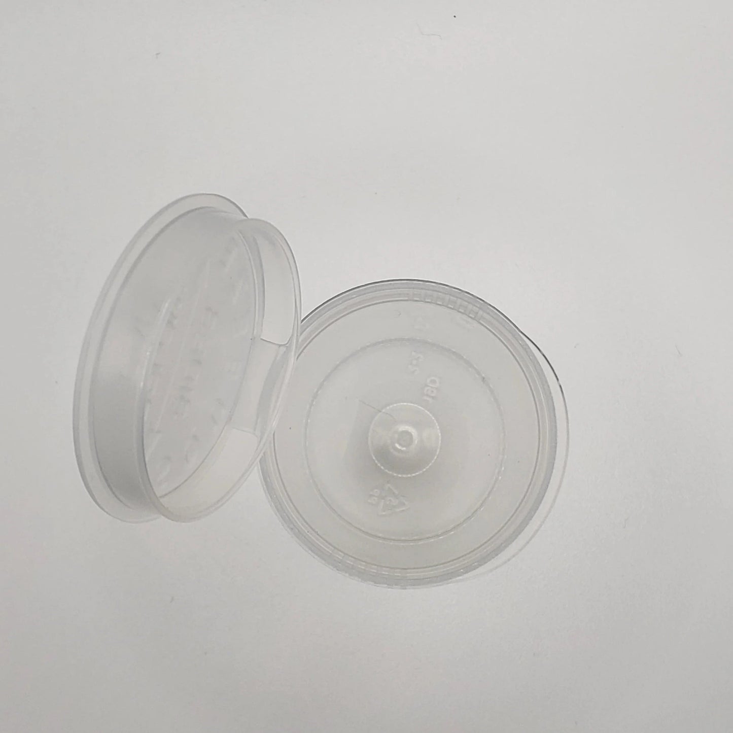 Two clear plastic containers on a light gray background