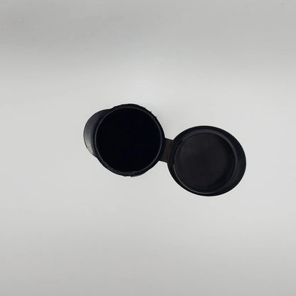 Black round object on a gray background