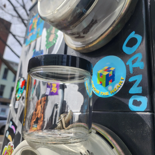 16oz glass jar with a black plastic lid