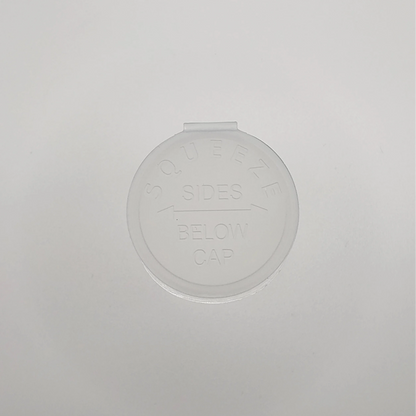 Round clear container on a light gray background