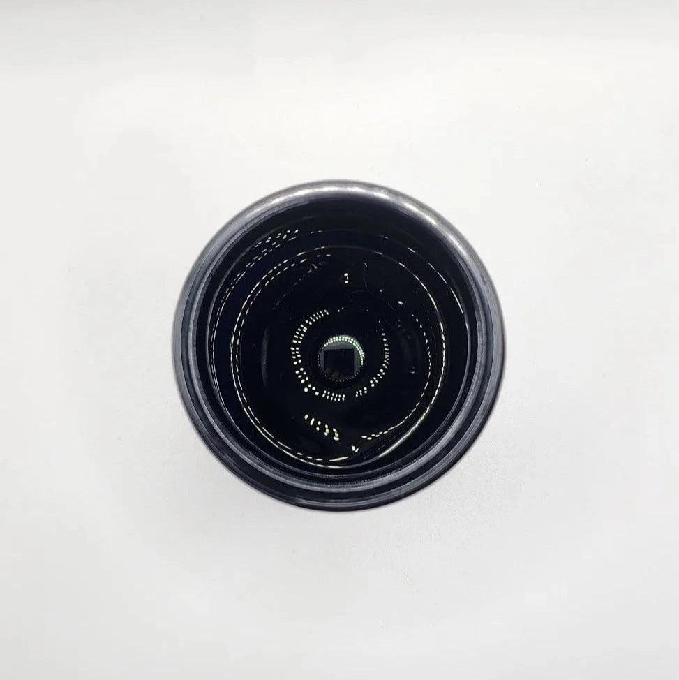 Black glass jar on a white background