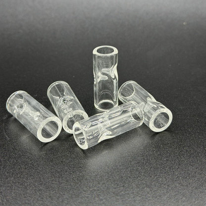 Clear plastic tubes with two pinches on a dark background