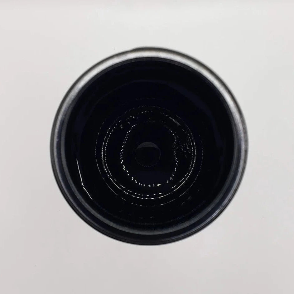 Close-up of a black glass jar
