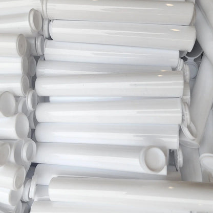 Stack of white plastic straws with connectors