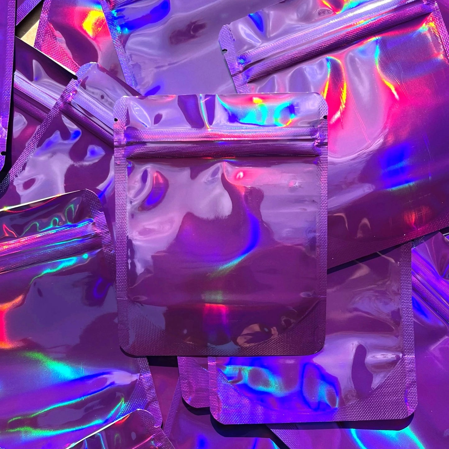 GD Purple Holographic 4x5 mylar bag on top of mylar