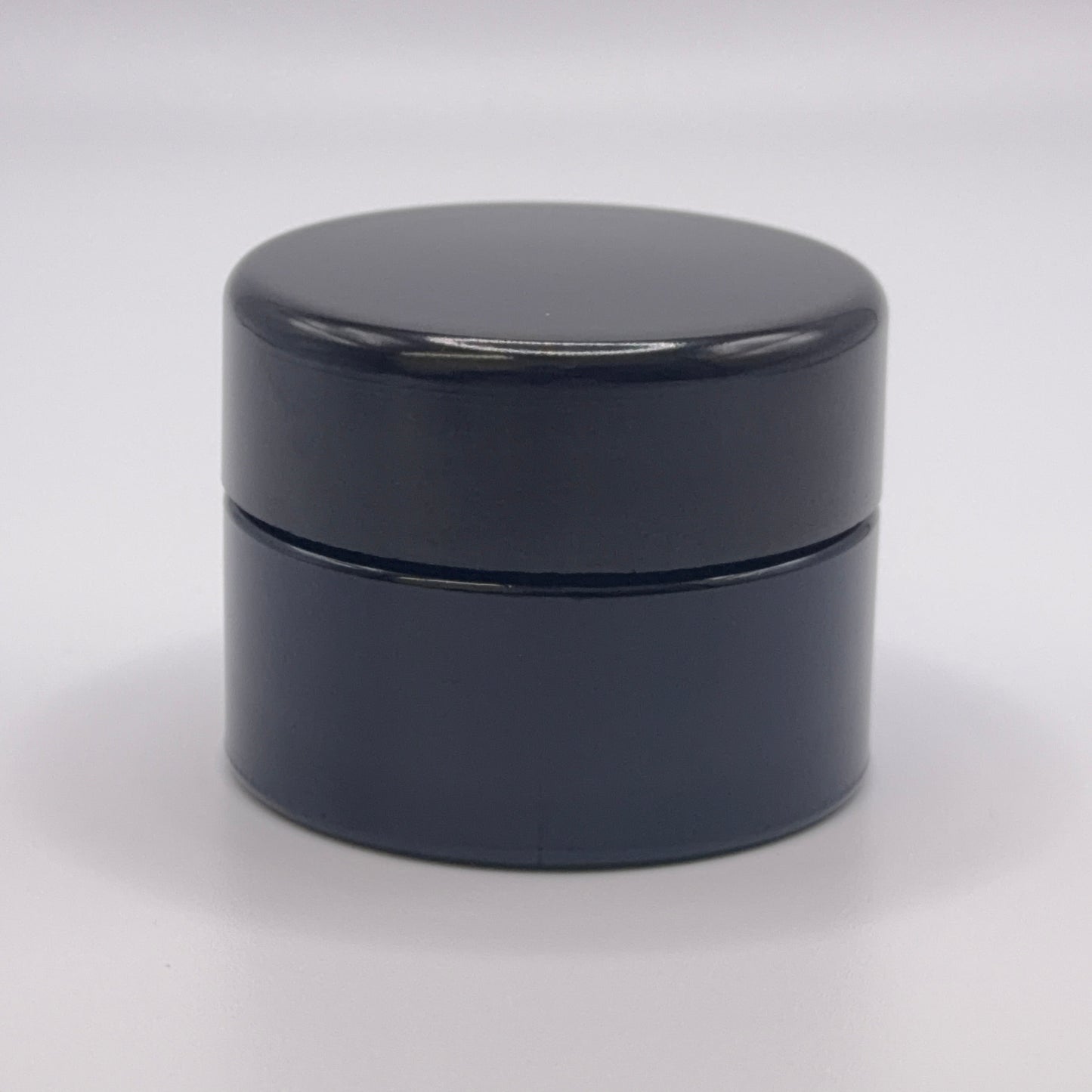 15 milliliter Miron UV glass jar on a white background