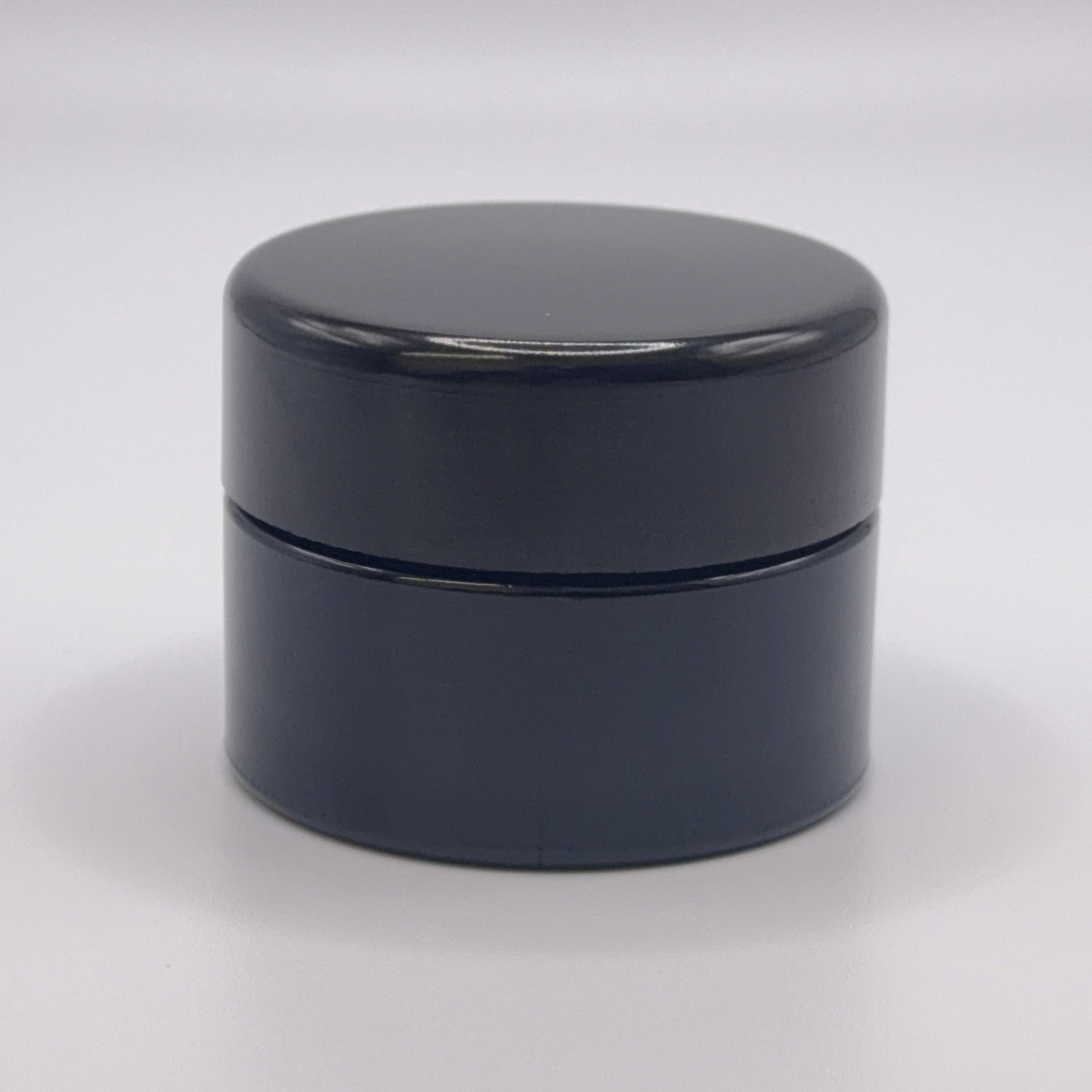 15 milliliter Miron UV glass jar on a white background