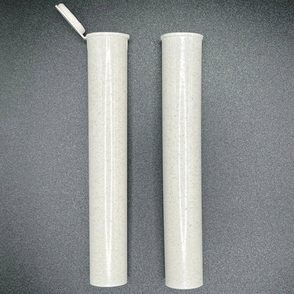 Two cylindrical white objects with a textured surface on a gray background