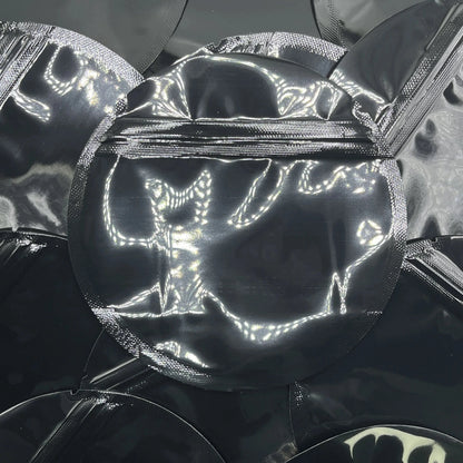 Black circle mylar bags on top of mylar bags