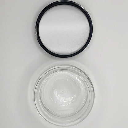 Black rubber gasket and glass jar on a white background