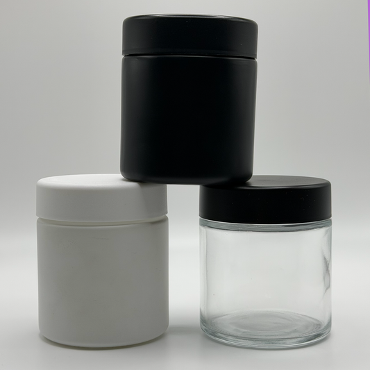 Three 3oz CR glass jars in front of a white background