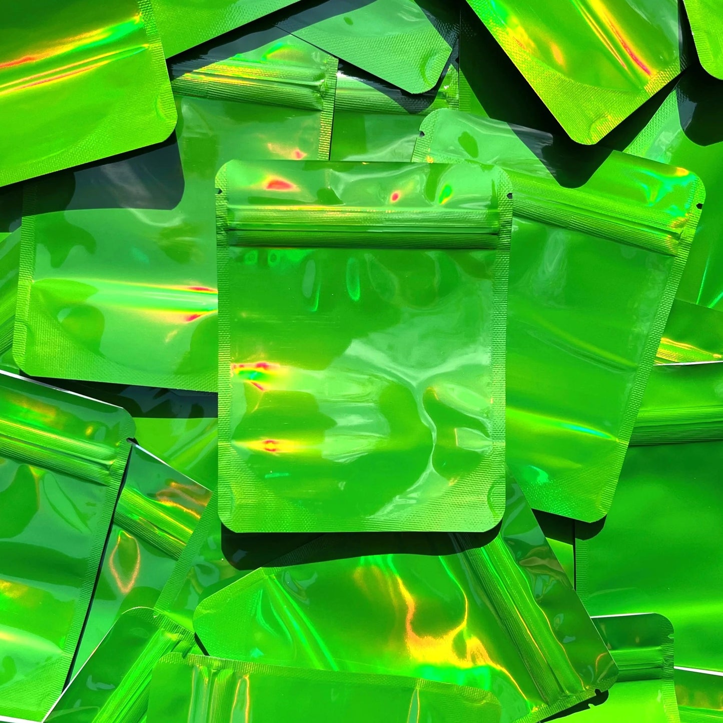Emerald Green Holographic 4x5 mylar bag on top of mylar bags