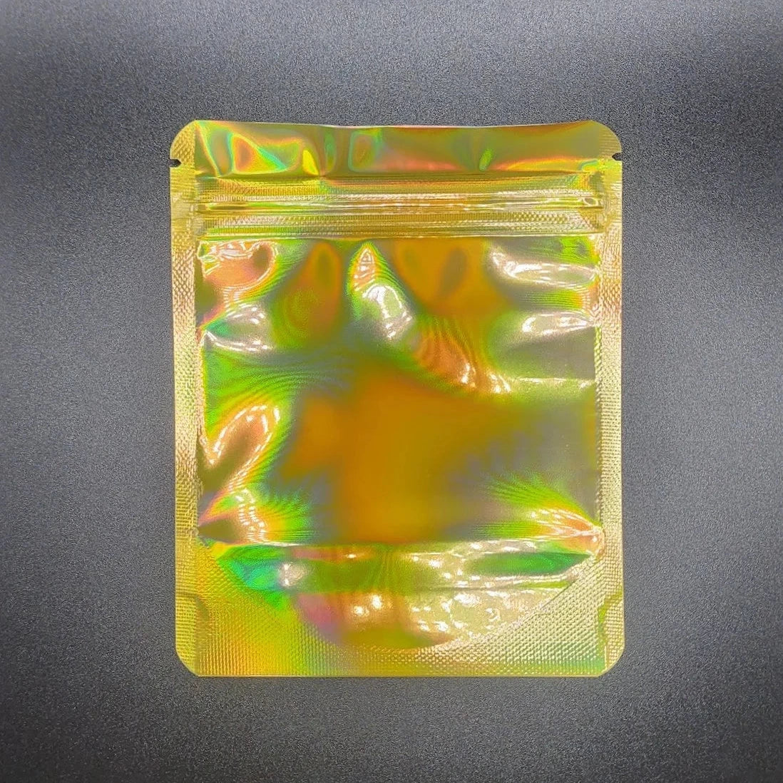 Holographic gold 4x5 mylar bag on a black background