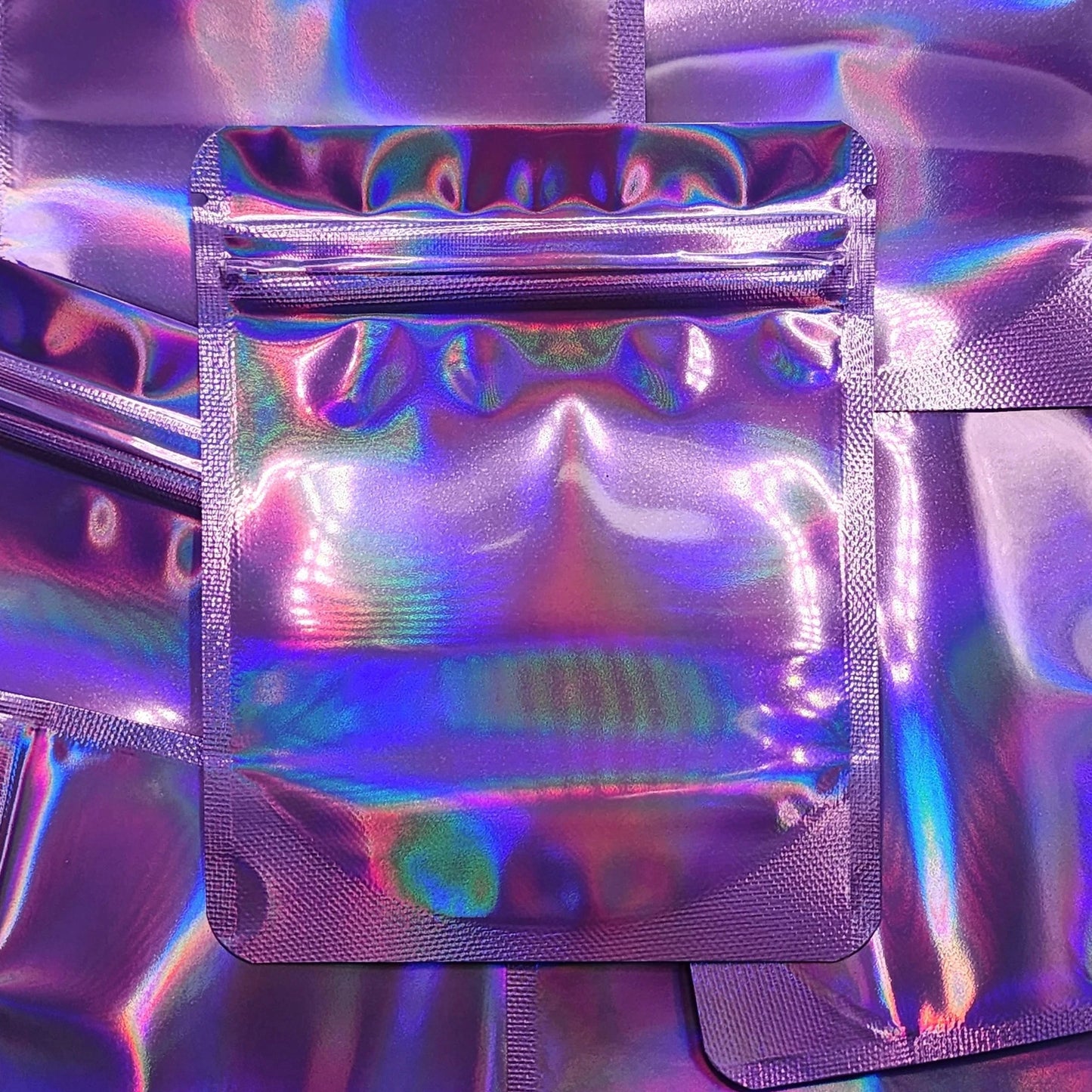 Lilac Lavender Holographic 4x5 mylar bags on top of mylar bags