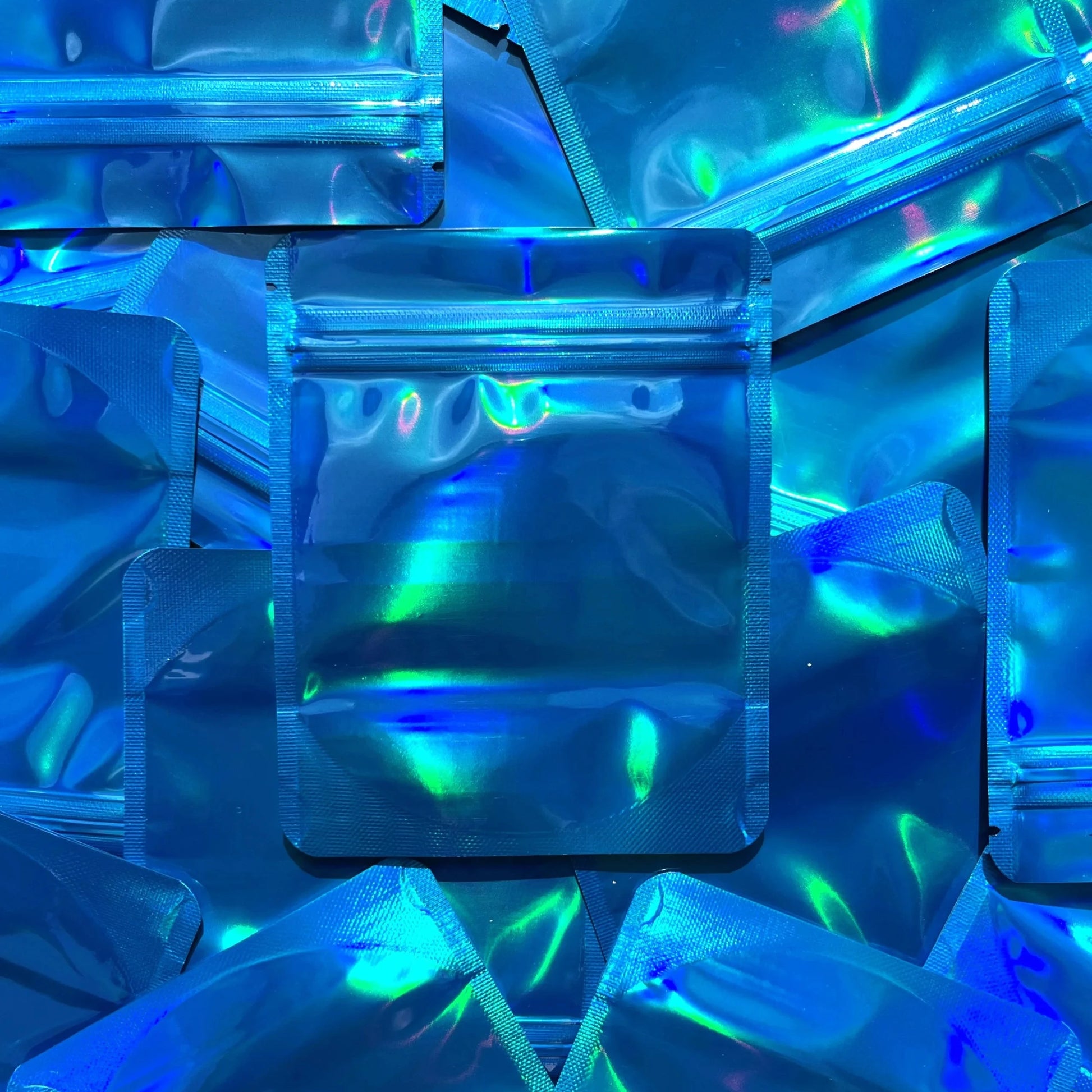 Miami Blue Holographic 4x5 mylar bags on top of mylar bags
