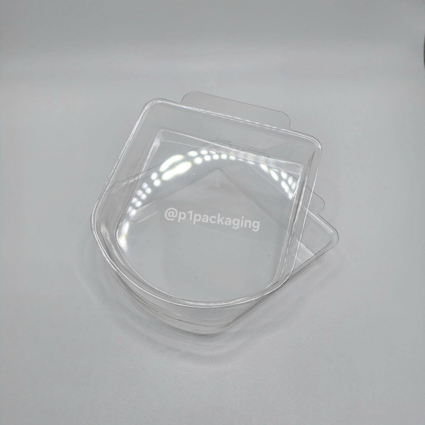 Two clear plastic trays on a white background