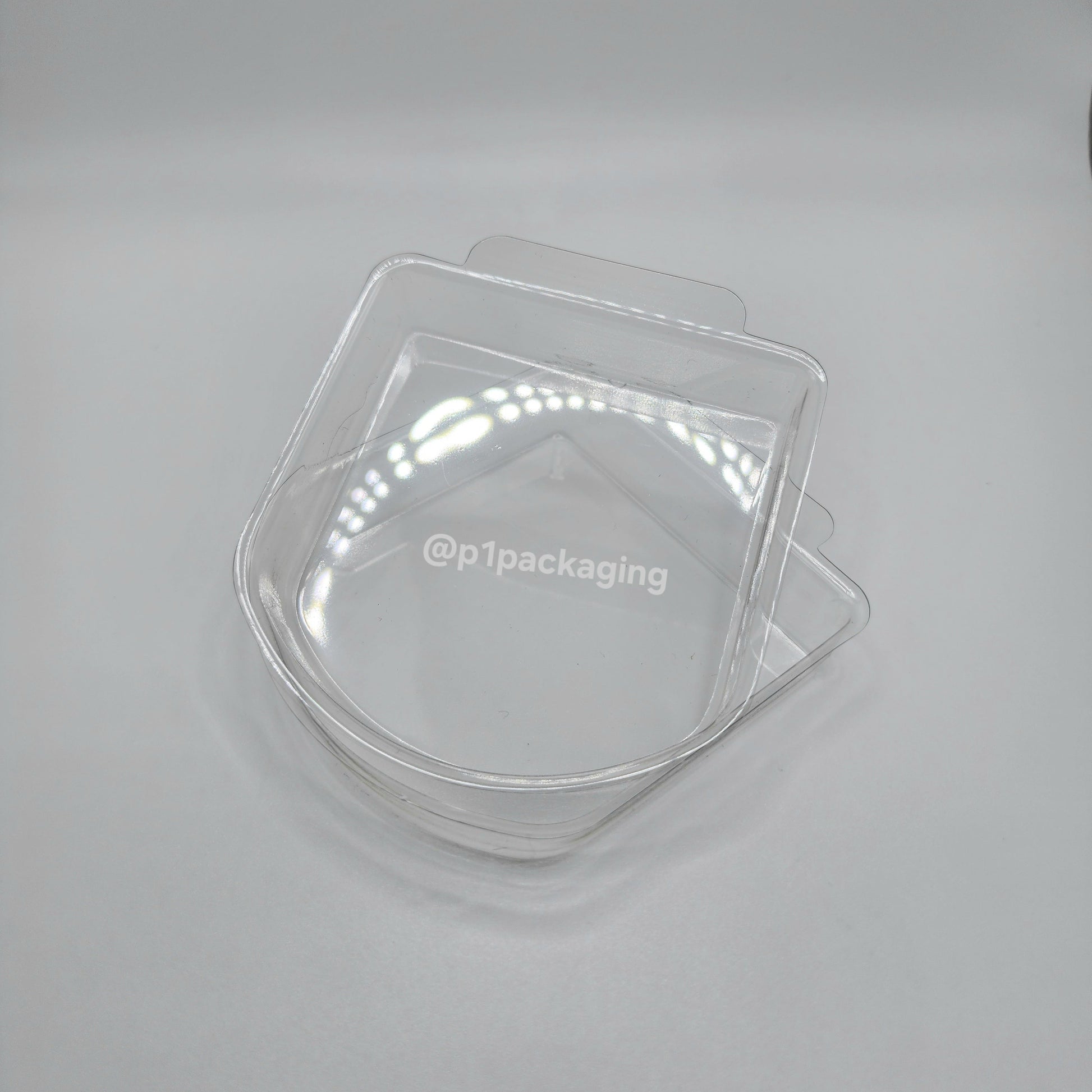 Two clear plastic trays on a white background