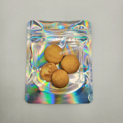 Holographic packaging with four cookies in a clear tray