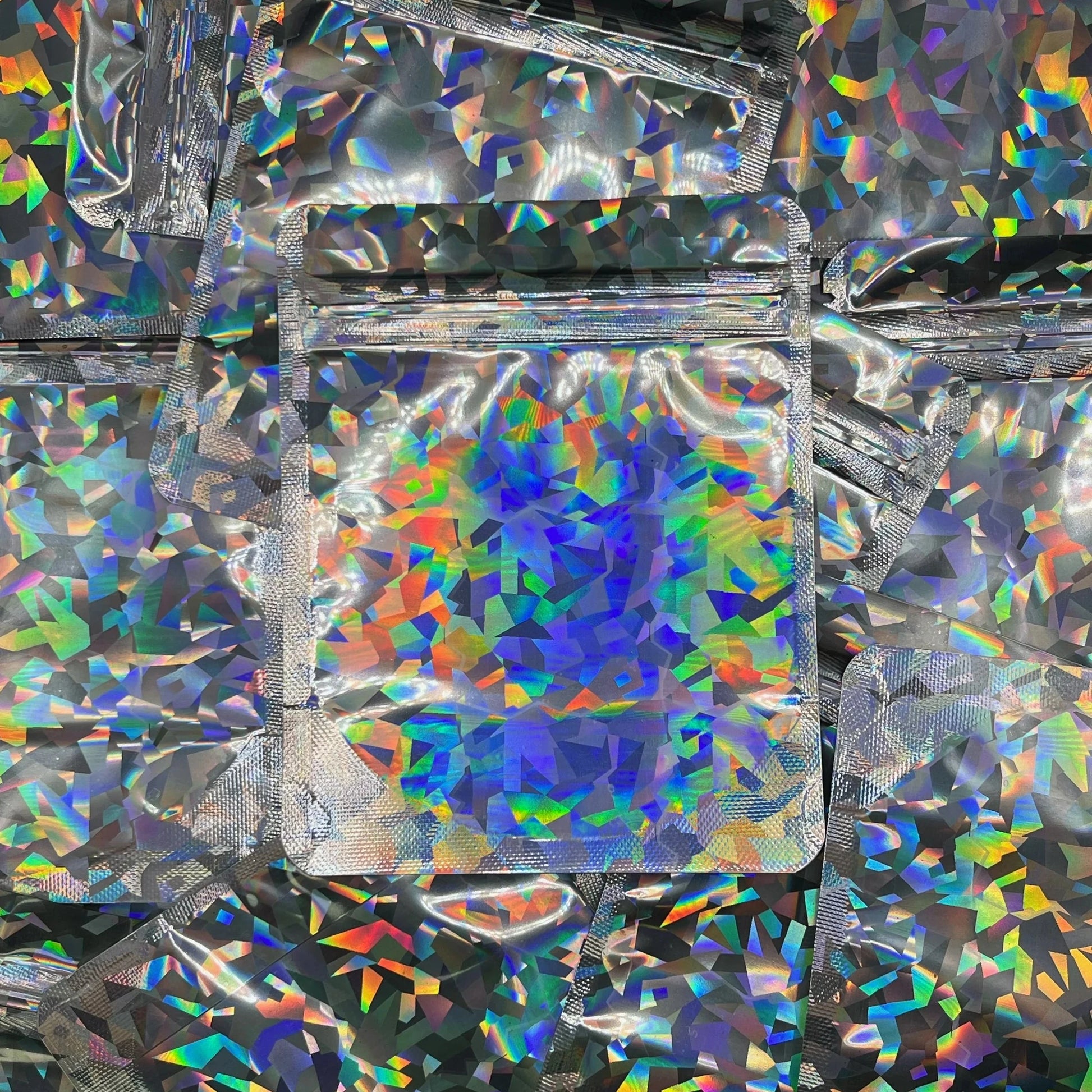 Prismatic Holographic 4x5 mylar bag on top of mylar bags