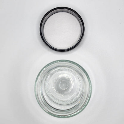 Clear glass bowl with black rubber gasket on a white background