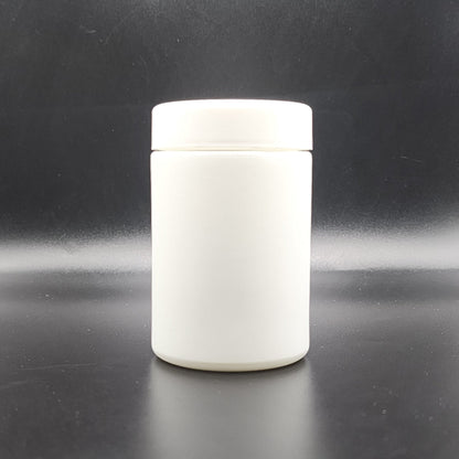 White ceramic jar with lid on a black background