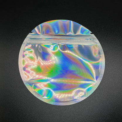 Silver holographic round mylar bag on a black background