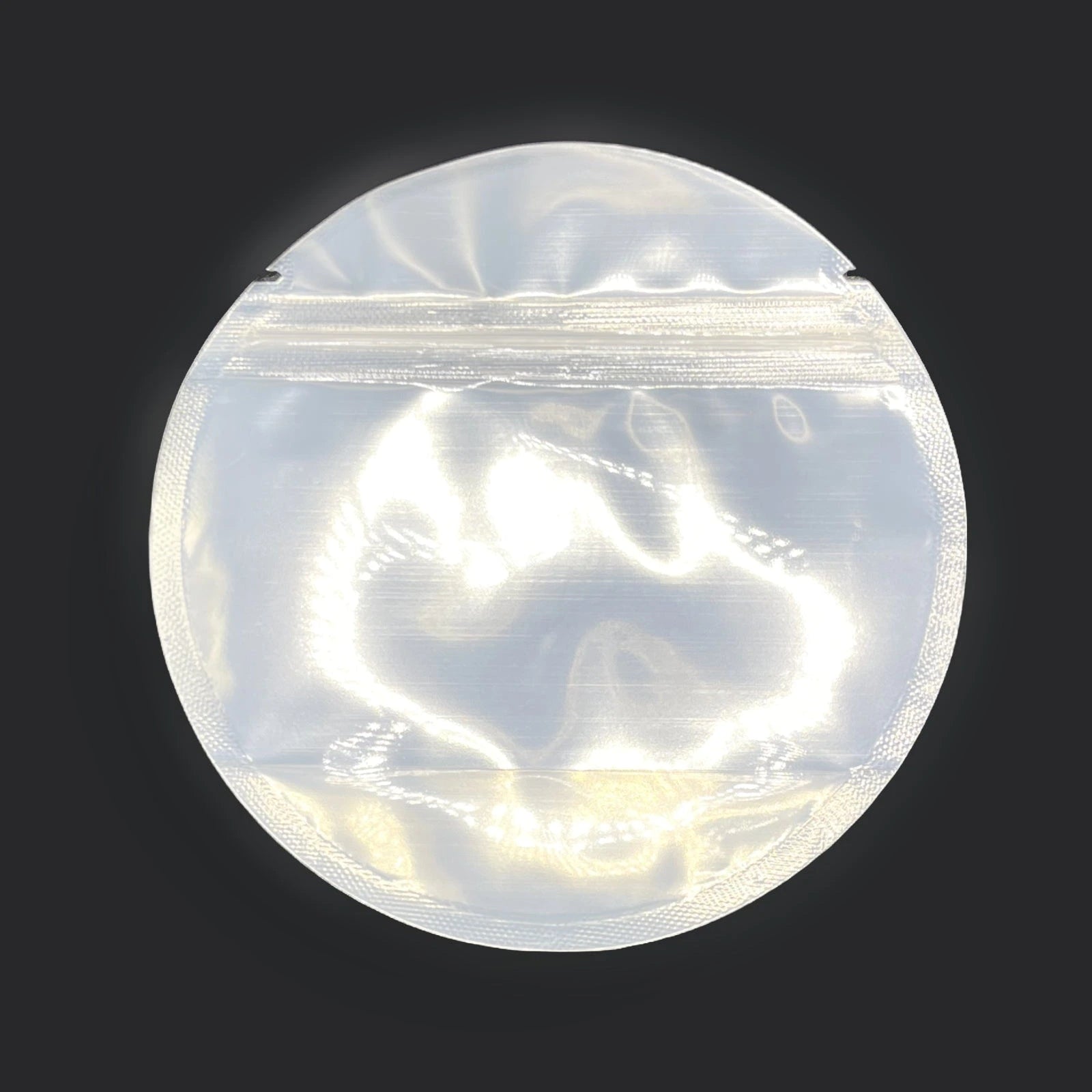 Circle mylar bag on a black background